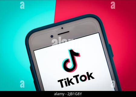 Kumamoto, JAPAN - May 17 2021 : Logo of TikTok on smartphone on 2 Tone Color bg. TikTok was launched in 2017 by ByteDance, founded in 2012 in Beijing Stock Photo