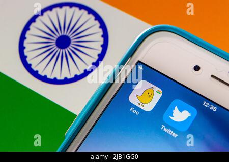 Kumamoto, JAPAN - May 13 2021 : Koo app, an Indian microblogging SNS based in Bengaluru, Karnataka, India, with Twitter app on iPhone on Indian flag Stock Photo