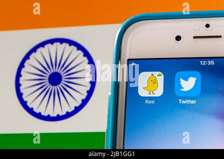 Kumamoto, JAPAN - May 13 2021 : Koo app, an Indian microblogging SNS based in Bengaluru, Karnataka, India, with Twitter app on iPhone on Indian flag Stock Photo