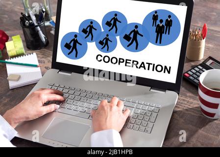 Cooperation concept shown on a laptop screen Stock Photo