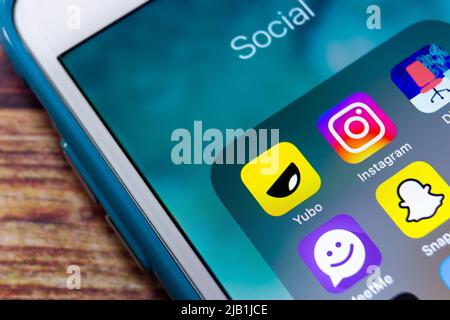 Kumamoto, JAPAN - Jul 19 2021 : Yubo app with Instagram, Dialup app, MeetMe, Snapchat, Hoop app, TikTok & Twitter on iPhone. Teenager or gen z concept Stock Photo