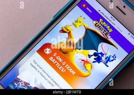 Kumamoto, JAPAN - Aug 10 2021 : Website of Pokemon Unite, online battle arena video game developed by TiMi Studio Group, on iPhone Stock Photo