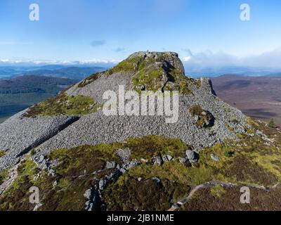 Aerial photograph of the distinctive granite plug and hillfort remains on the Mither Tap on top of the mountain of Bennachie, Aberdeenshire, Scotland Stock Photo