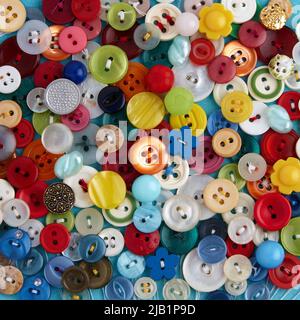 Background from multi-colored clothes buttons. Beautiful background for creativity and needlework Stock Photo