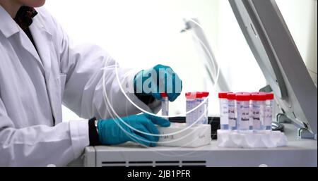 Image of circles over female scientist in laboratory Stock Photo
