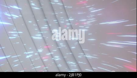 Image of light trails over white circles Stock Photo