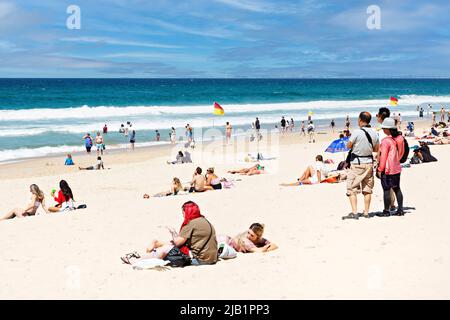 Queensland Australia /  Tourists and locals alike enjoy the sunshine, seaside and beach at Surfers Paradise. Stock Photo
