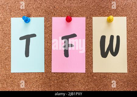 Conceptual 3 letter acronym abbreviation TFW (That feeling when) on multicolored stickers attached to a cork board. Stock Photo