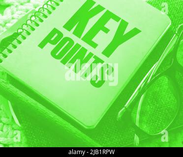 text KEY POINTs on the cover of a book, eye glasses and pen. Business education concept. Stock Photo