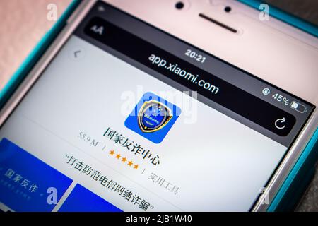 Kumamoto, JAPAN - Oct 25 2021 : Chinese anti-fraud app “National Anti-fraud Center” in Xiaomi’s App Store in iPhone in dark mood. Stock Photo