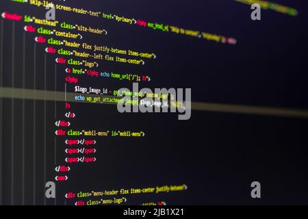 The software developer using dual screen is coding. Stock Photo