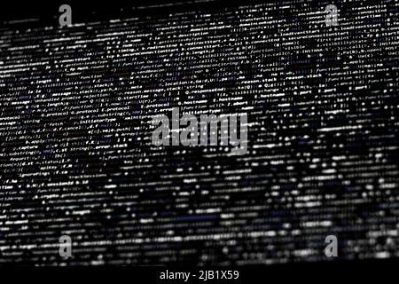 Black and white code background. javascript code on computer screen Stock Photo