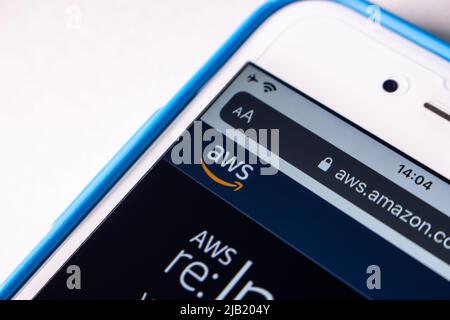 Closeup AWS (Amazon Web Services) logo on its website on iPhone. AWS is a providing on-demand cloud computing platforms and APIs by Amazon Stock Photo