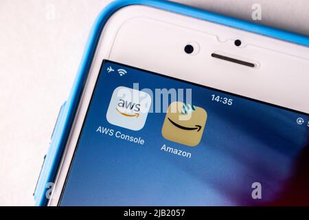 AWS Console (Amazon Web Services) and Amazon app icons on iPhone. AWS is a providing on-demand cloud computing platforms and APIs by Amazon Stock Photo