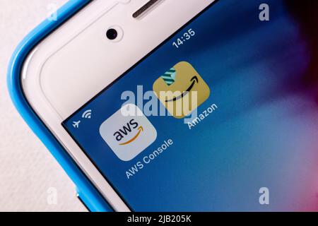 AWS Console (Amazon Web Services) and Amazon app icons on iPhone. AWS is a providing on-demand cloud computing platforms and APIs by Amazon Stock Photo