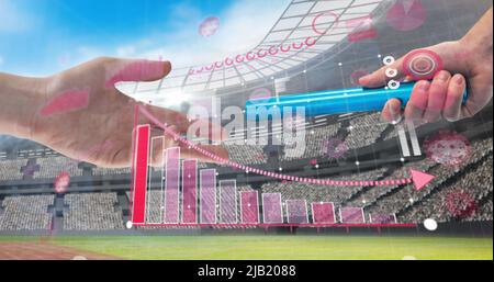 Coronavirus statistical data processing against hand passing a baton against sports stadium Stock Photo