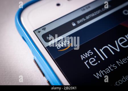 Closeup AWS (Amazon Web Services) logo on its website on iPhone. AWS is a providing on-demand cloud computing platforms and APIs by Amazon Stock Photo