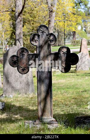 An old cross on old graveyard Stock Photo