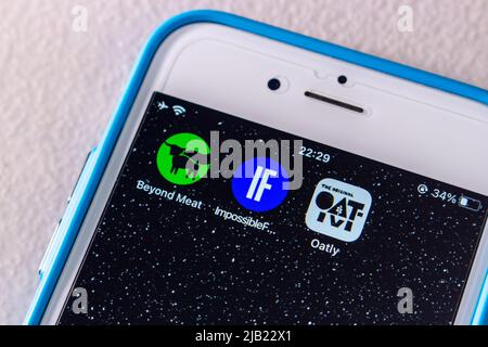 Kumamoto, JAPAN - Feb 14 2022 : The leading alternative protein brand logos (Beyond Meat, Impossible Foods and Oatly) on an iPhone screen. Stock Photo