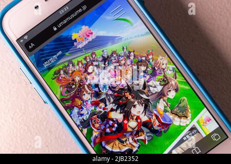 The opening screen of Uma Musume Pretty Derby app (Translation : Horse Girl Pretty Derby) on the iPhone. Uma Musume is multimedia franchise by Cygames Stock Photo