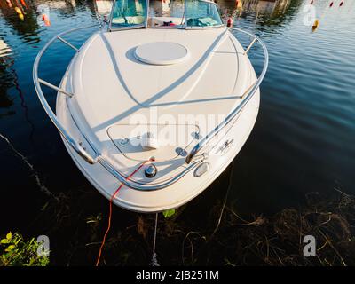 view from top on moored motorboat bow on a lake Stock Photo