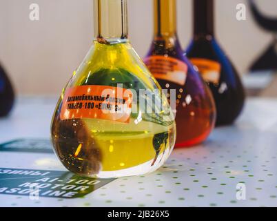 Kazan, Russia. May 19, 2022. Glass flask with a sample of TANECO-100 motor gasoline of EURO-6 standard. Products of Tatneft Refinery. Stock Photo