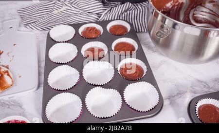 Scooping Batter With A Cupcake Scoop To Make Unicorn Cupcakes