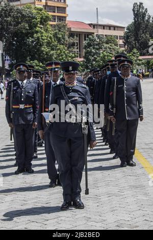 Kenyan police officers are seen in their ceremonial uniforms at a parade during the commemoration of 59th Madaraka Day Celebrations held at Railways Grounds in Nakuru City. Kenya attained self-rule on June 1st, 1963 from the hands of the British colonial government. Stock Photo