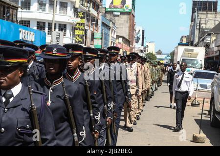 Kenyan police officers are seen in their ceremonial uniforms at a parade during the commemoration of 59th Madaraka Day Celebrations held at Railways Grounds in Nakuru City. Kenya attained self-rule on June 1st, 1963 from the hands of the British colonial government. Stock Photo