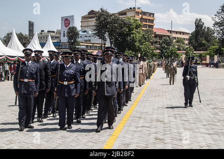 Kenyan police officers are seen in their ceremonial uniforms at a parade during the commemoration of 59th Madaraka Day Celebrations held at Railways Grounds in Nakuru City. Kenya attained self-rule on June 1st, 1963 from the hands of the British colonial government. Stock Photo