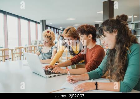 Diverse students working on project together Stock Photo