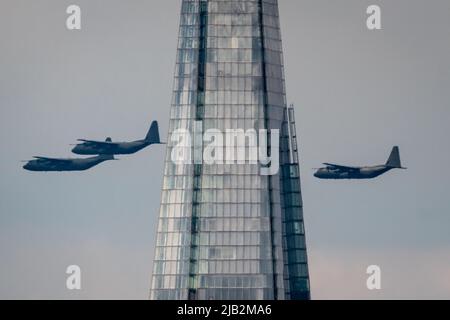 London, UK. 2nd June, 2022. Platinum Jubilee: Royal Air Force Flypast. Up to 70 RAF aircraft soar over the city en route to Buckingham Palace in a six-minute flypast featuring x3 Hercules carrier planes(pictured, passing The Shard) as part of the first day of Platinum Jubilee celebrations. The flypast includes more than three times the number of aircraft which took part in the Queen's last birthday parade in 2019. Credit: Guy Corbishley/Alamy Live News Stock Photo