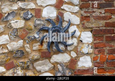 Norfolk Brick and Flint Close-up Showing the Structure, Pattern and Texture.  Also included is a Star-shaped Wall Tie. Stock Photo