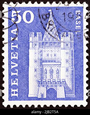 SWITZERLAND - CIRCA 1960: A stamp printed in Switzerland from the 'Architectural Monuments' issue shows Spalentor gate, Basel, circa 1960. Stock Photo