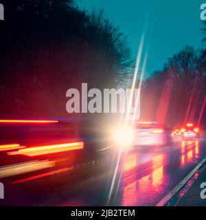 Heavily trafficked country road in the dark near Frankfurt am Main Stock Photo