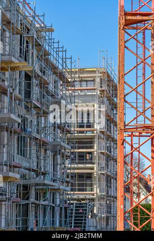 Shell construction of an apartment building with scaffolding and crane in Bad Homburg (Vickers - Areal) near Frankfurt am Main Stock Photo