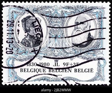BELGIUM - CIRCA 1980: A stamp printed in Belgium shows King Leopold II and Queen Marie Henriette, circa 1980. Stock Photo