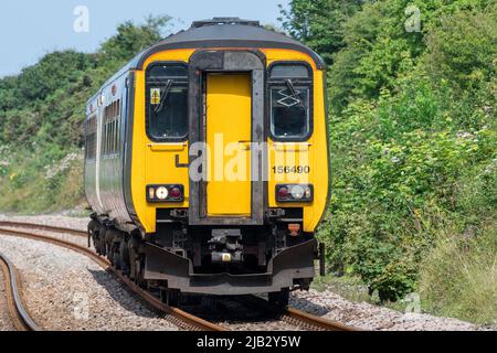 Class 156 156490 approaches Hawthorn Dene viaduct on the Durham Coast Line south of Seaham, County Durham, UK Stock Photo