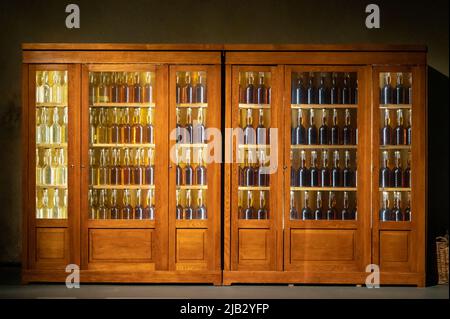 Different ages and colours of strong alcoholic apple drink calvados in Normandy, Calvados region, France, calvados tasting tour Stock Photo