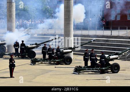 Reservists from 104 Regiment Royal Artillery perform the 42 gun salute for the Queen's Platinum Jubilee at Roald Dahl Plass, Cardiff Bay, Wales Stock Photo