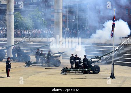 Reservists from 104 Regiment Royal Artillery perform the 42 gun salute for the Queen's Platinum Jubilee at Roald Dahl Plass, Cardiff Bay, Wales Stock Photo