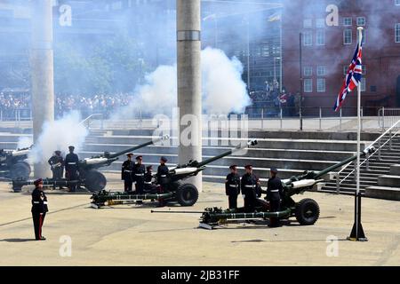 Reservists from 104 Regiment Royal Artillery perform the 42 gun salute for the Queen's Platinum Jubilee at Roald Dahl Plass, Cardiff Bay, Wales Stock Photo