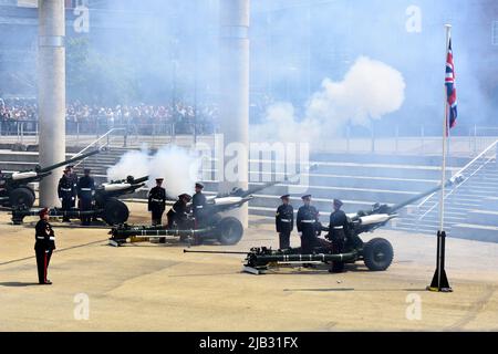 Reservists from 104 Regiment Royal Artillery perform the 42 gun salute for the Queen's Platinum Jubilee at Roald Dahl Plass, Cardiff Bay, Wales Stock Photo