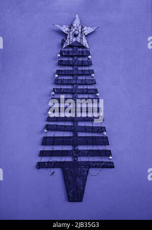 Christmas tree made from planks outdoor DIY decoration Xmas upcycling handcraft, toned image Stock Photo