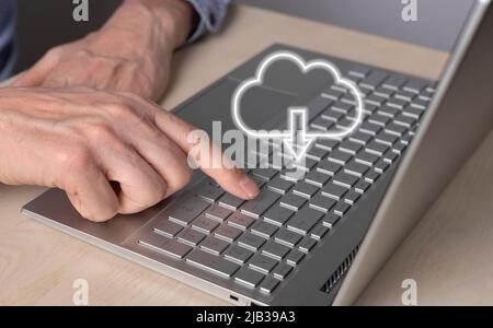 Cloud computing. Man using laptop for download files from remote database. Forefinger closeup pressing on enter button. Online service for storing objects. High quality photo Stock Photo