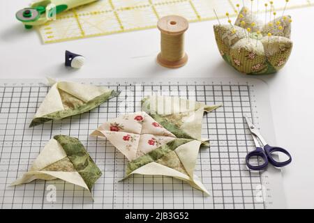 Patchwork block sewing process, pincushion, sewing and quilting accessories Stock Photo