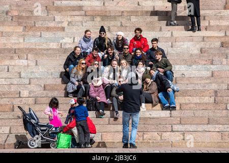Group of young people posing for a photo on Helsinki Cathedral steps in Helsinki, Finland Stock Photo