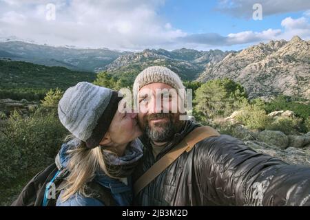 Couple taking a selfie in the mountains Stock Photo