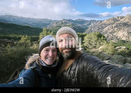 Couple taking a selfie in the mountains Stock Photo