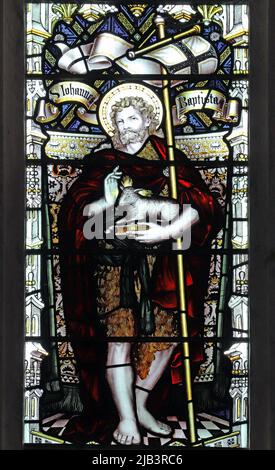 A stained glass window by C E Kempe & Co. depictingSt John the Baptist, All Saints Church, Leighton Buzzard, Bedfordshire Stock Photo